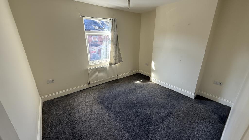 Lot: 133 - VACANT END-TERRACE HOUSE - Inside image of Bedroom 1 from landing